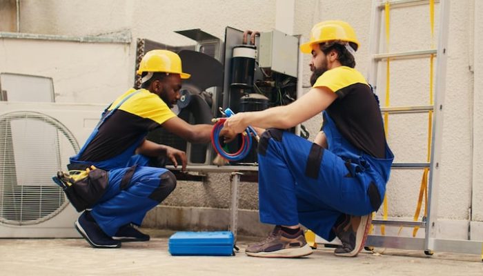coworkers-servicing-hvac-system_482257-91024
