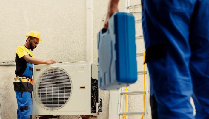 engineer-arriving-location-help-apprentice-mend-busted-electric-coils-damaged-external-air-conditioner-technicians-comissioned-prevent-internal-parts-breakdowns-ensuring-timely-repair_482257-75177