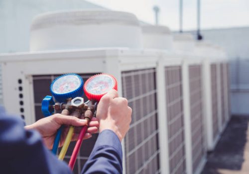 Technician is checking air conditioner ,measuring equipment for filling air conditioners.