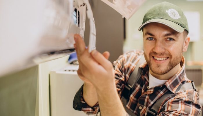 repairman-doing-air-conditioner-service_1303-26543