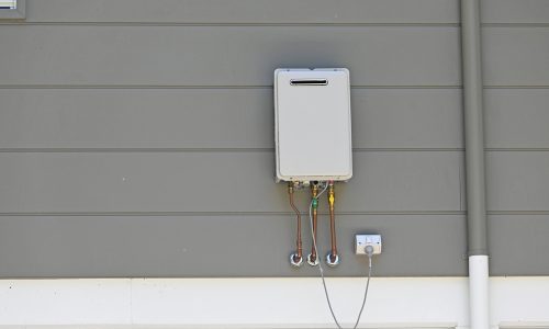 Instantaneous,Gas,Hot,Water,Heater,On,The,Side,Of,A